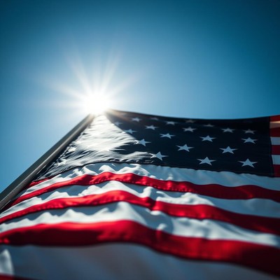 The american flag waves in the sun