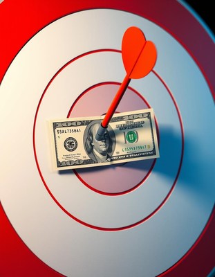 A red dart hits a $100 bill in the center of a target