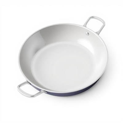 A white ceramic pan sits on a white surface