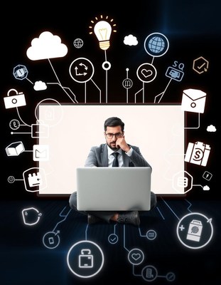 A man works on his laptop surrounded by digital icons