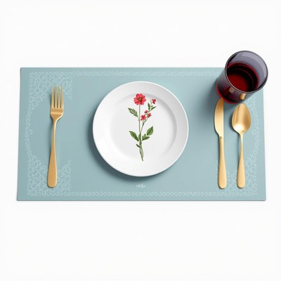 A blue placemat with a white plate and floral design