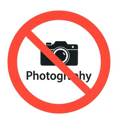 Red circle with diagonal line: no photography