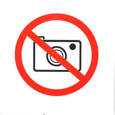 A no photography sign is displayed