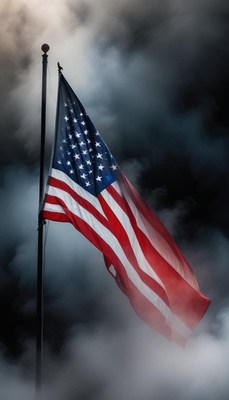 An american flag waves in the wind against a stormy sky