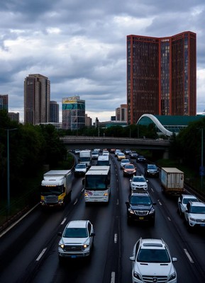 Cars drive on a highway in a city