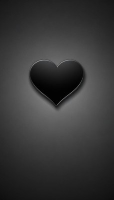 A black heart sits on a grey background