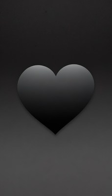 A black heart shape against a dark background