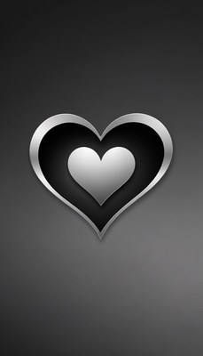 A silver heart sits within a black heart