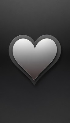 A silver heart on a black background