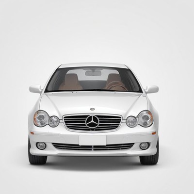 A silver mercedes-benz c-class is parked in a studio