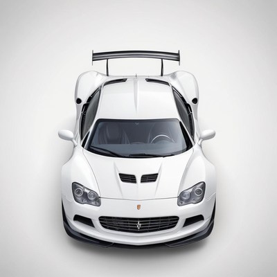 A white sports car is parked on a white background