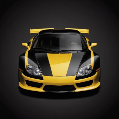 A yellow and black sports car sits on a black background