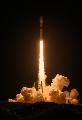 A rocket launches into the night sky