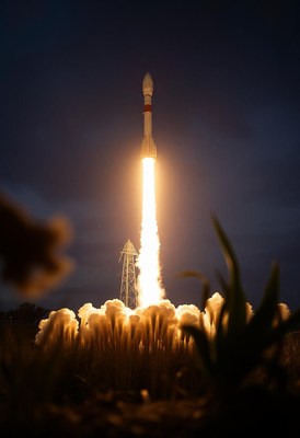 A rocket launches into the night sky