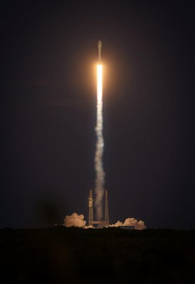 A rocket launches into the night sky