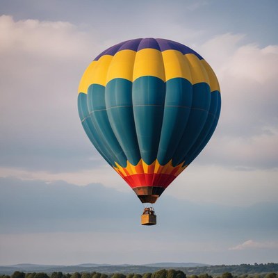 A colorful hot air balloon floats in the sky