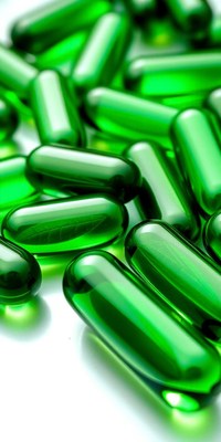Green capsules on a white surface