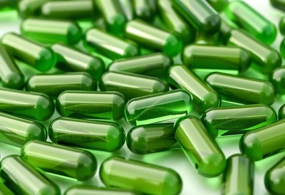 Green capsules with visible leaf inside