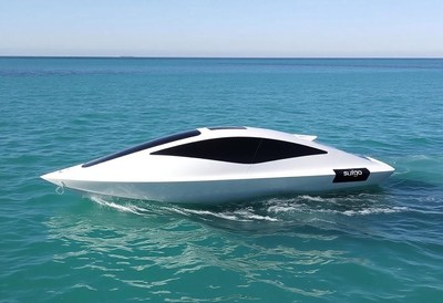 A white boat cruises through the ocean