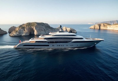 A large yacht cruises past rocky islands