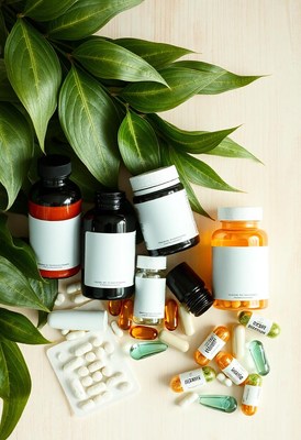 Herbal supplements and pills on a wooden surface