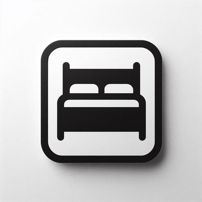 A black and white bed icon on a white background