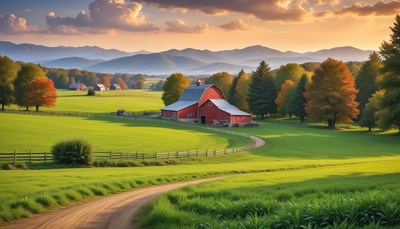 A red barn on a green hill by a winding road