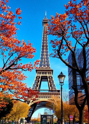 The eiffel tower stands tall against a blue sky in paris