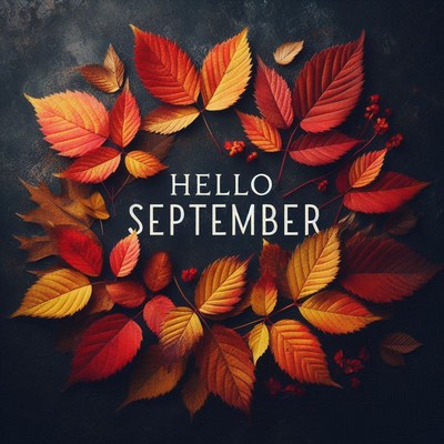 Autumn leaves form a wreath around hello september