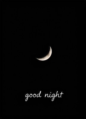 A crescent moon shines brightly in the night sky