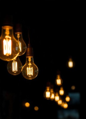 Warm light bulbs illuminate the night