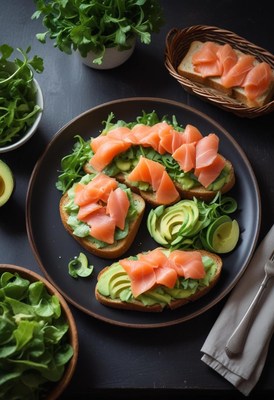 Three avocado and smoked salmon toasts on a black plate