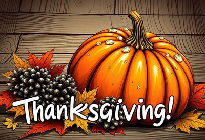 A large pumpkin sits on a wooden table with fall leaves