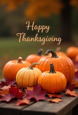 Pumpkins and leaves on a wooden table for thanksgiving