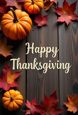 Pumpkins and leaves on a wooden background