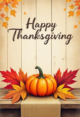 Happy thanksgiving with a pumpkin and fall leaves