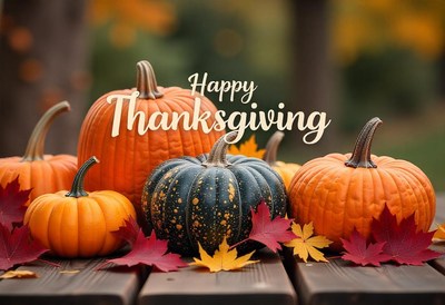 Happy thanksgiving with pumpkins and fall leaves