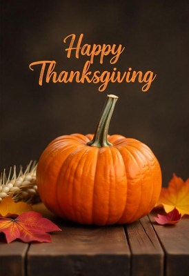 Happy thanksgiving with a pumpkin and fall leaves