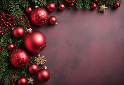 Red ornaments and pine branches on a burgundy background