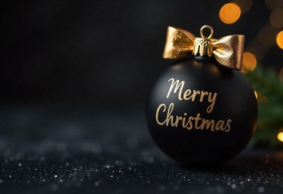 Black ornament with gold bow and merry christmas