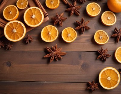 Dried orange slices and star anise on a wooden surface