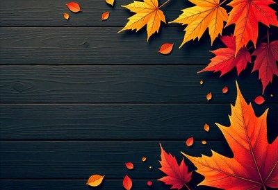 Autumn leaves scattered on a dark wood background