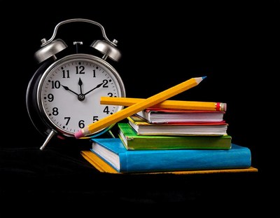 10, and two yellow pencils are crossed over the top of it