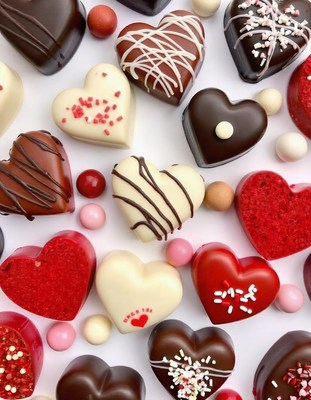 Assorted heart-shaped chocolates on a white background