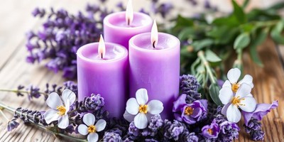 Purple candles sit in a bed of lavender