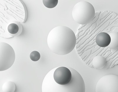 White and gray spheres float on a white background