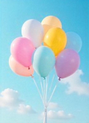 Pastel balloons float against a blue sky