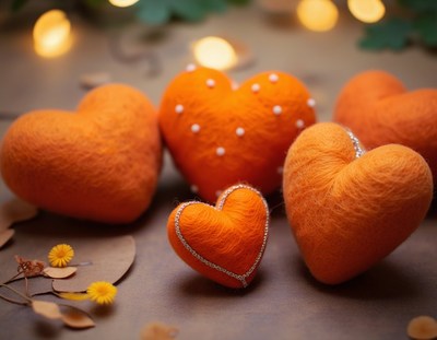 Orange felt hearts on a table