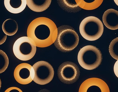 Golden rings blur and shine against a dark background