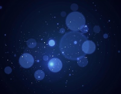 Blue bokeh lights sparkle against a dark background